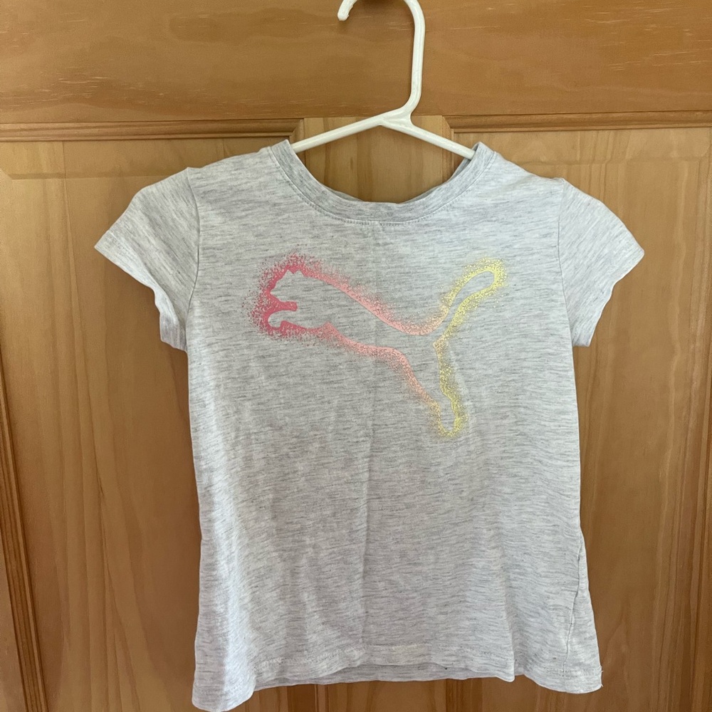 Used Girls Size 5 Puma T-Shirt, stain on the back. See Pictures